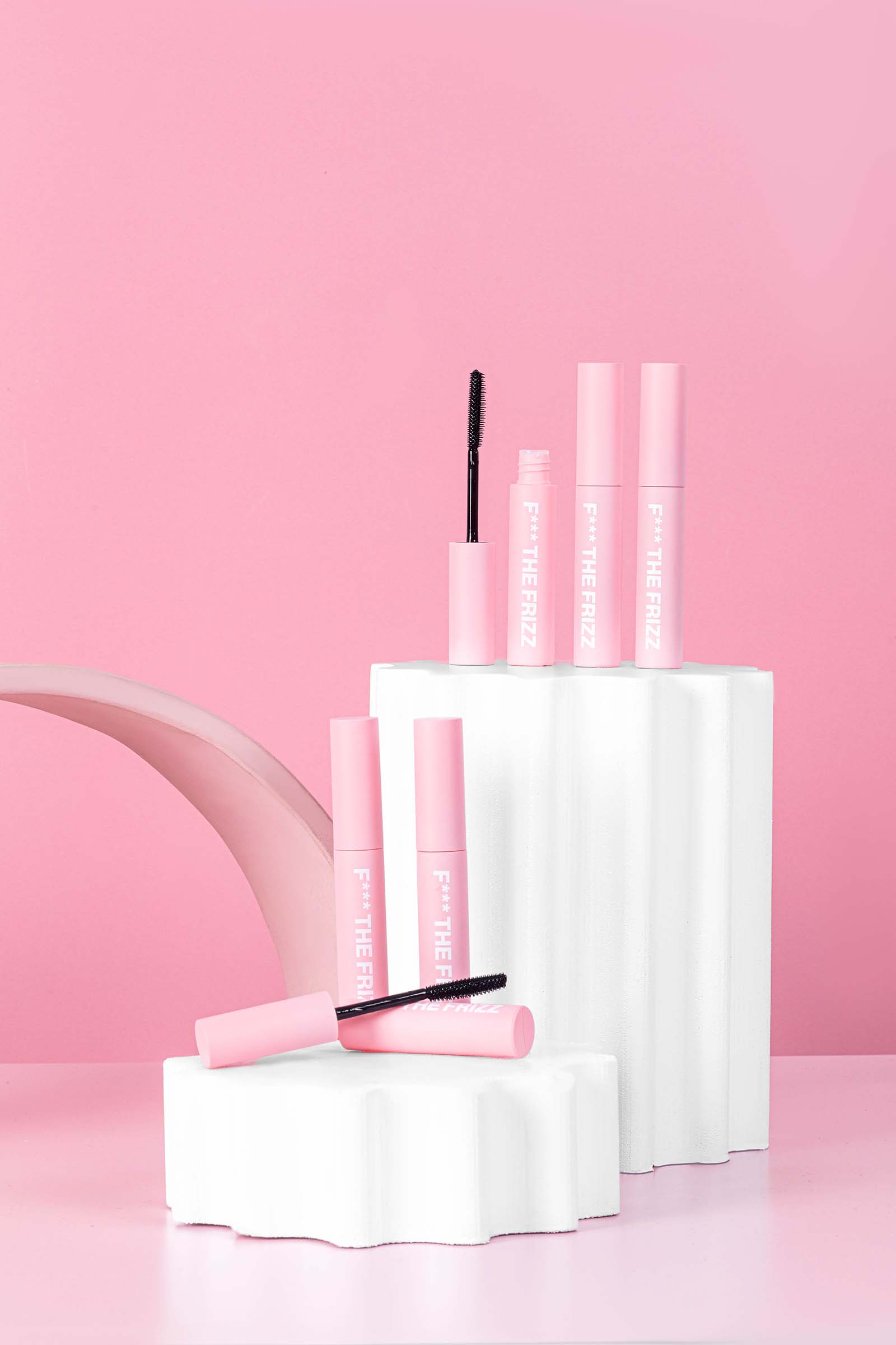 Creative and Fun Pink Product Photos for Anit Frizz Hair Wand. Styled content creation by Megzie Makes