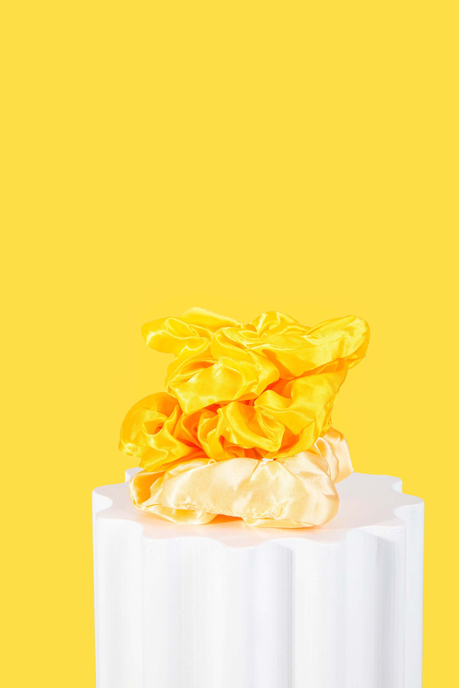 Creative Yellow Product Photography for Hair Scrunchies. Styled by Megzie Makes