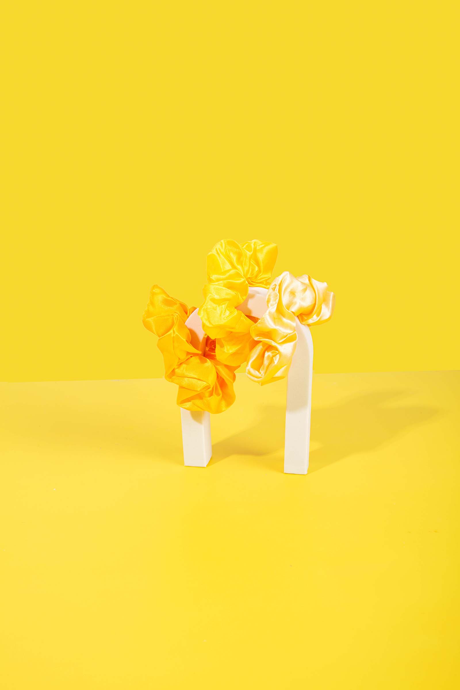 Creative Yellow Product Photography for Hair Scrunchies. Styled by Megzie Makes 