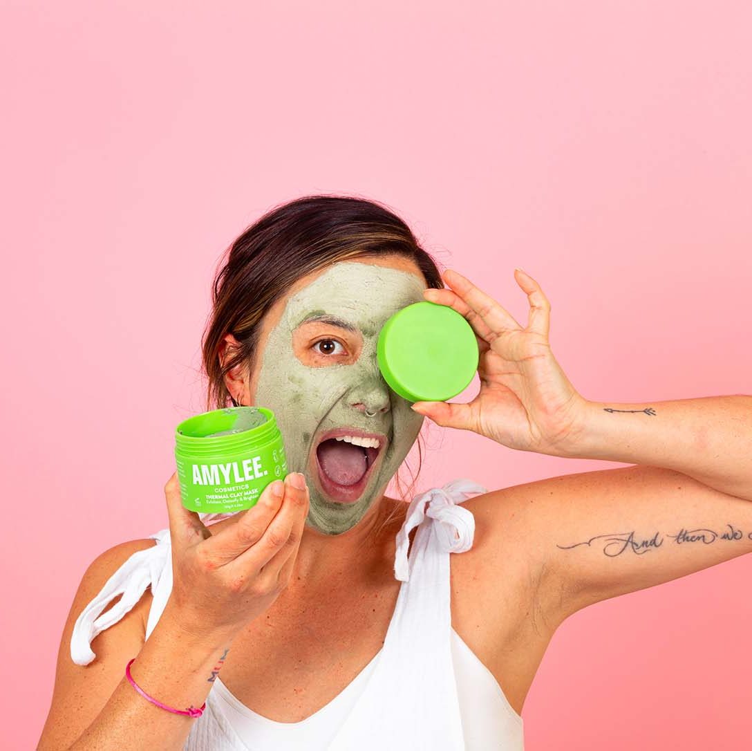 Fun pink model photos for a clay mask brand. Styled product photos by Megzie Makes