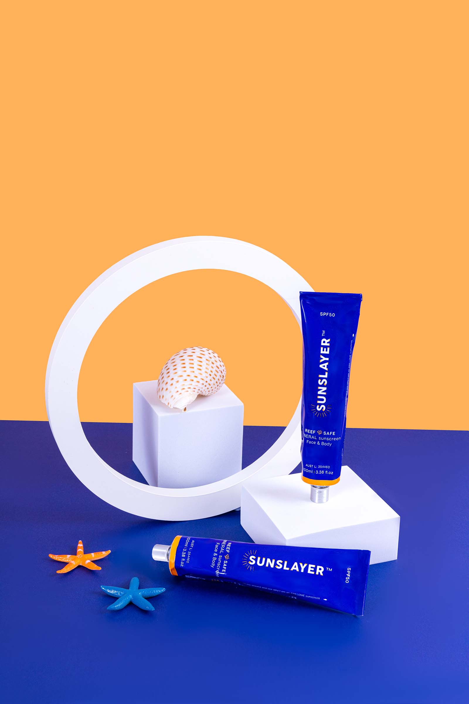Bold Product Photos for a Sunscreen Brand. Orange and Blue product photography by Colourpop Studio