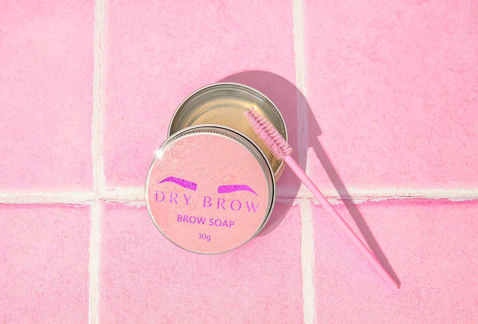 PInk and Orange Proudct photos for skincare brand dry brow. Pink aesthetic image styled by product photographer colourpop studio